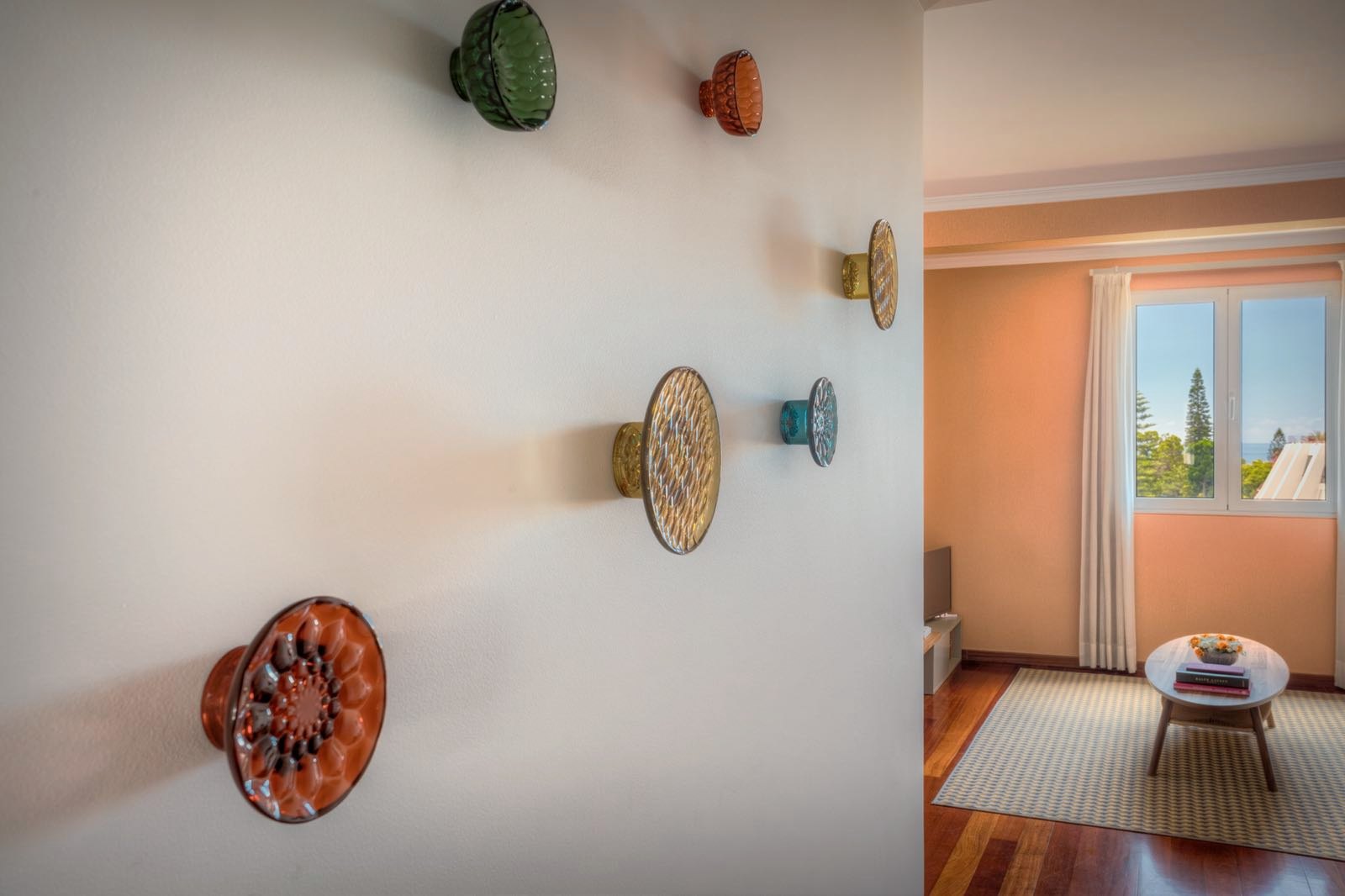 Santa Catarina Apartment — Ceramic pieces arranged on a white wall